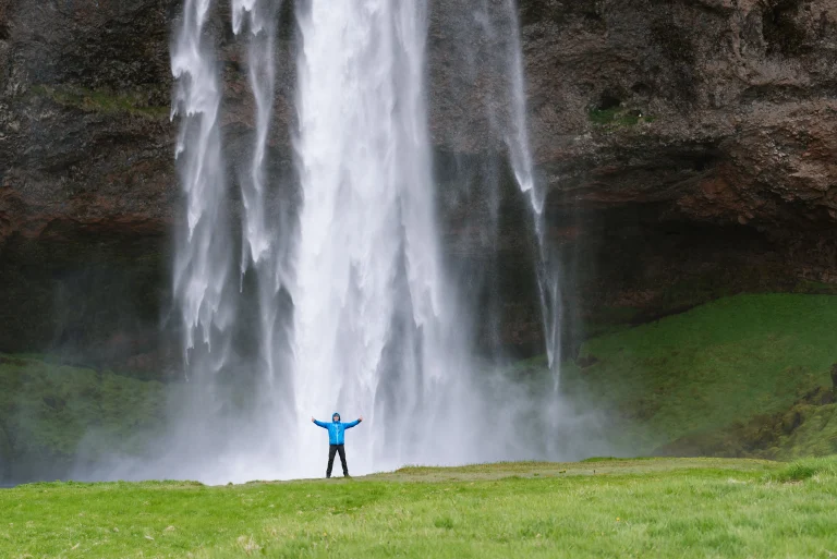 tourist-near-a-seljalandsfoss-waterfall-in-iceland-2025-03-07-21-40-52-utc